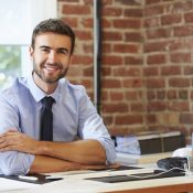 small biz owner Man Working At Computer In Contemporary Office